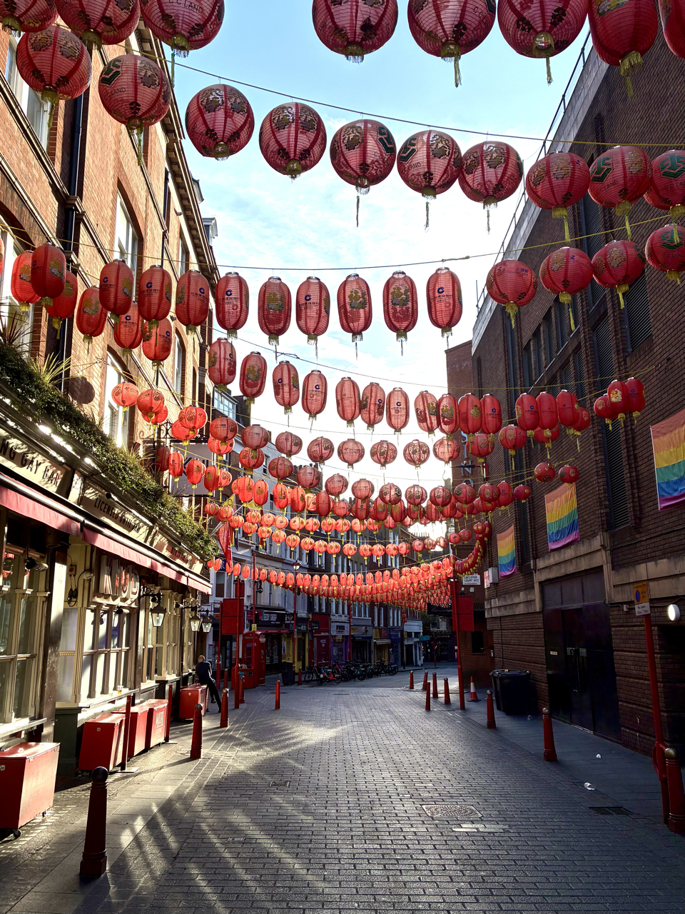 Rows of red Chinese lanterns hanging over a street in London Chinatown